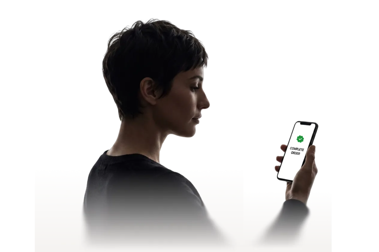 A woman holding a phone with a completed order screen, alongside a Guest Mode toggle switched on.