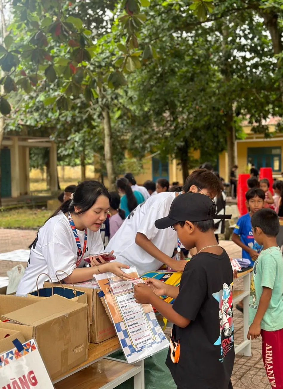 materials to children at an outdoor community event